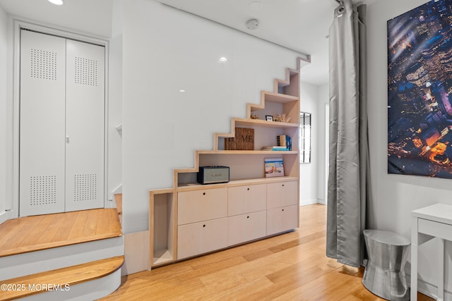 stairway featuring wood finished floors