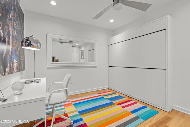 office area featuring baseboards, recessed lighting, light wood-type flooring, and ceiling fan