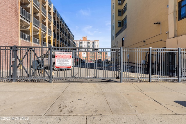 view of gate with fence