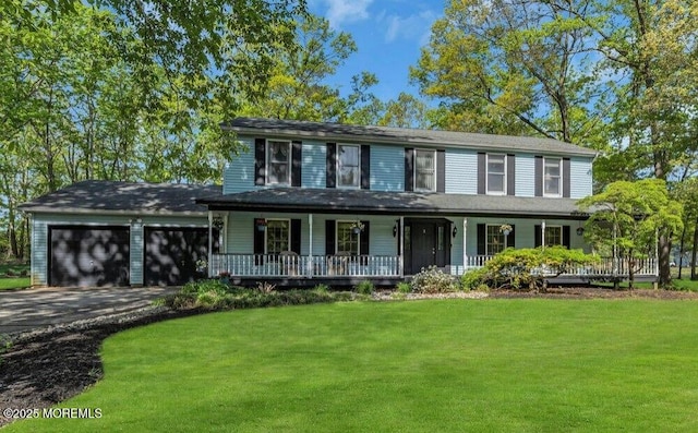 view of front facade featuring a porch, an attached garage, driveway, and a front lawn