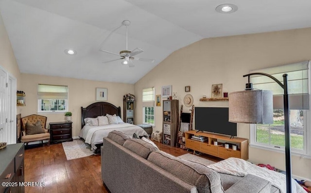 bedroom with dark wood-style floors, recessed lighting, multiple windows, and lofted ceiling