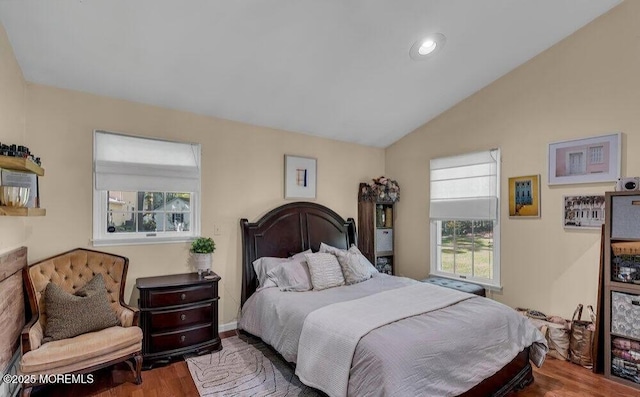 bedroom featuring vaulted ceiling, recessed lighting, and wood finished floors