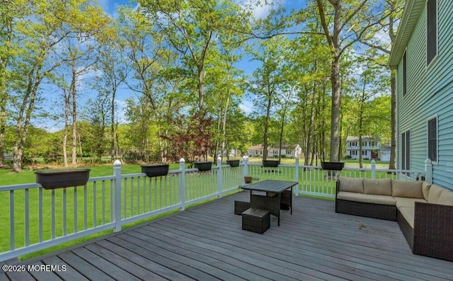 deck with an outdoor hangout area and a lawn