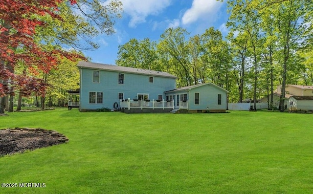 rear view of house with a lawn