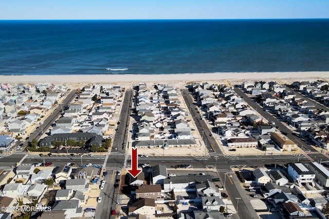 aerial view featuring a residential view, a beach view, and a water view