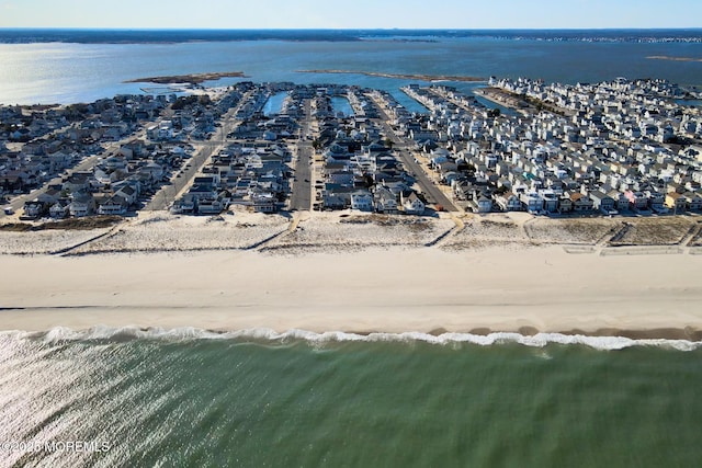 aerial view with a view of the beach and a water view