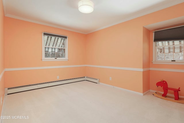 empty room featuring crown molding, baseboards, carpet floors, and a baseboard radiator