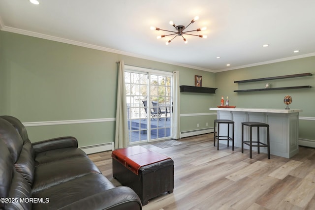 living area with light wood-type flooring, a baseboard heating unit, and a bar