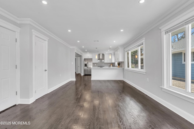 unfurnished living room with dark wood-type flooring, recessed lighting, baseboards, and ornamental molding