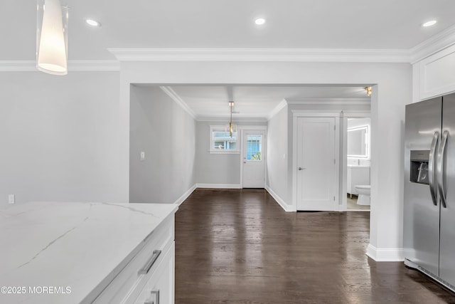 unfurnished dining area with recessed lighting, dark wood-style floors, baseboards, and ornamental molding