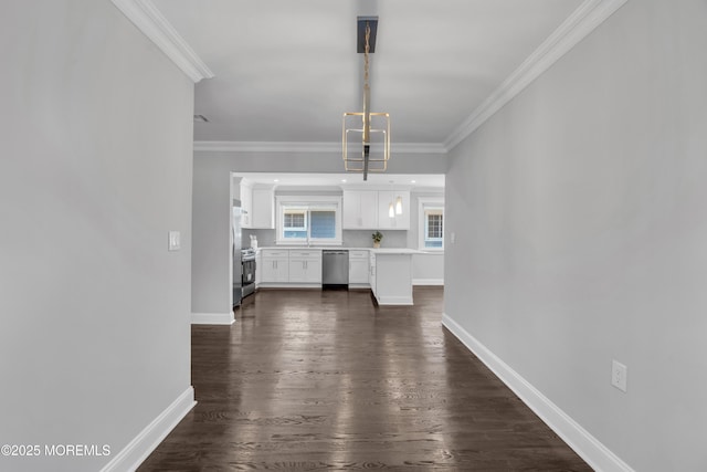 unfurnished living room with a sink, dark wood-style floors, baseboards, and ornamental molding