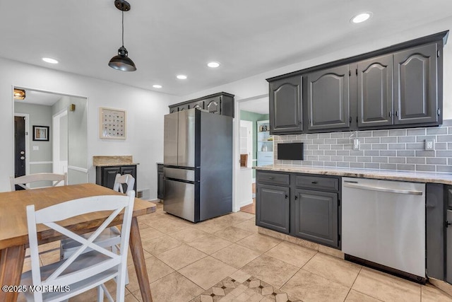 kitchen with light tile patterned floors, backsplash, recessed lighting, and appliances with stainless steel finishes