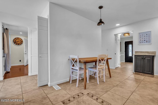 dining room featuring light tile patterned floors, visible vents, recessed lighting, and baseboards