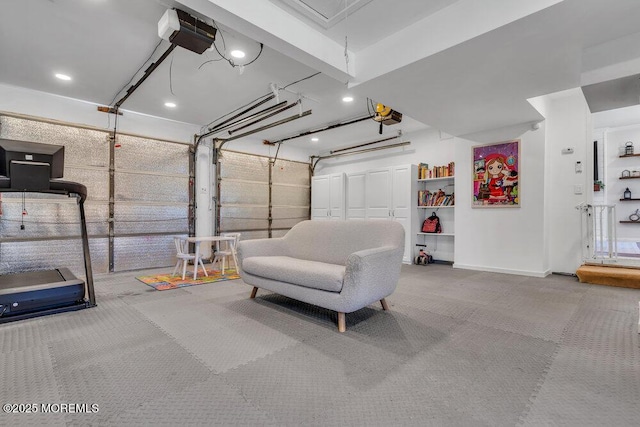 garage with a garage door opener and baseboards