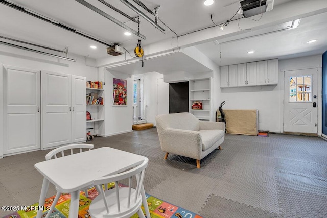 interior space with baseboards and a garage