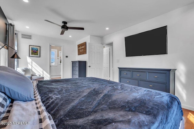 bedroom with visible vents, recessed lighting, baseboards, and wood finished floors