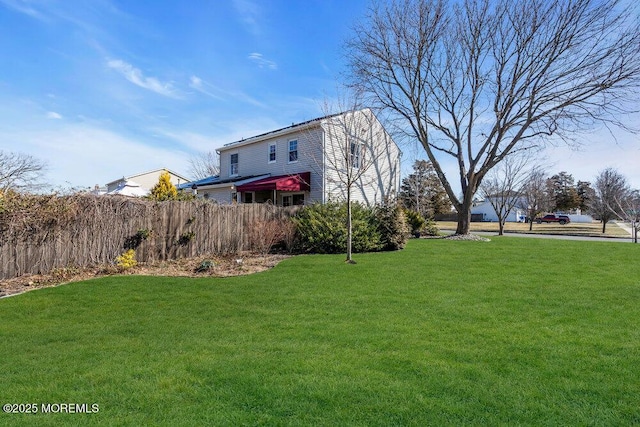 view of yard with fence