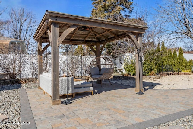 view of patio with a gazebo and fence