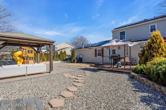 view of yard with a playground and a wooden deck