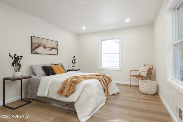 bedroom with light wood-style flooring, recessed lighting, and baseboards