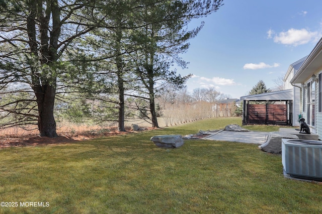 view of yard with a gazebo, cooling unit, and a patio area