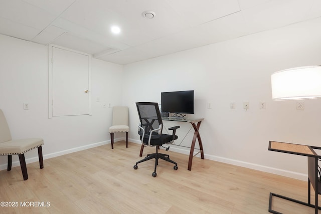 office space featuring light wood-style flooring and baseboards