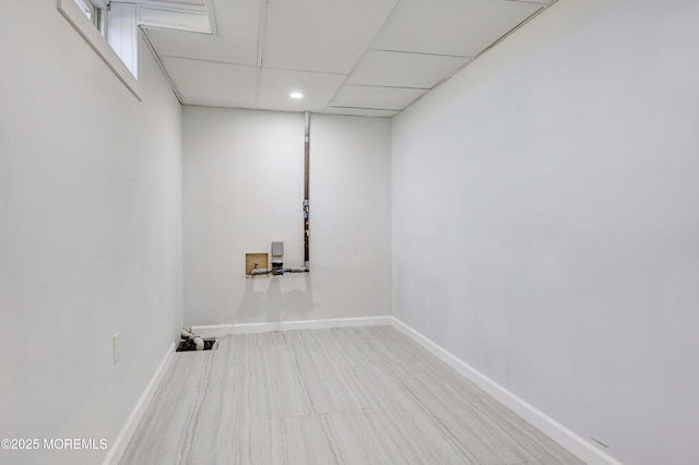 washroom featuring baseboards, washer hookup, and laundry area