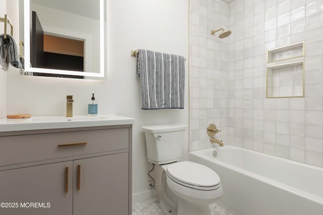 full bath featuring baseboards, toilet, shower / washtub combination, and vanity