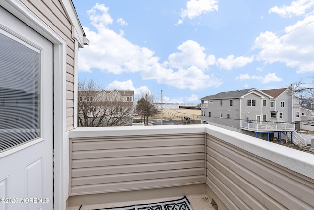 balcony featuring a residential view