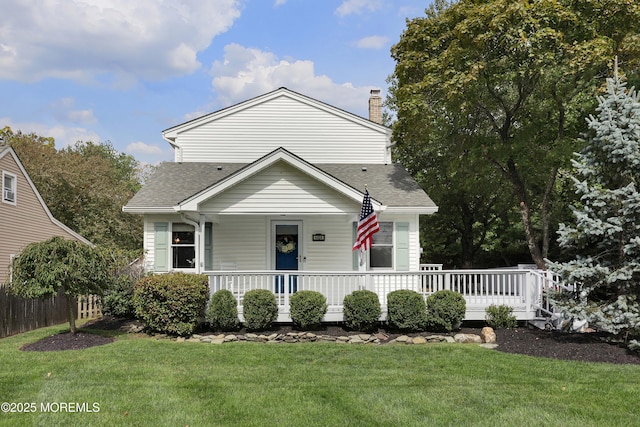 bungalow-style house with a front lawn, fence, a porch, roof with shingles, and a chimney