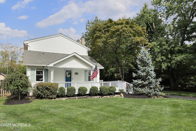 bungalow-style house featuring a porch, a chimney, a front yard, and a shingled roof