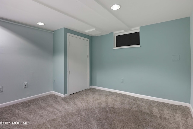 unfurnished room with recessed lighting, baseboards, and carpet