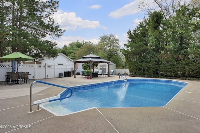 view of pool with a gazebo, a fenced in pool, fence, and a patio area