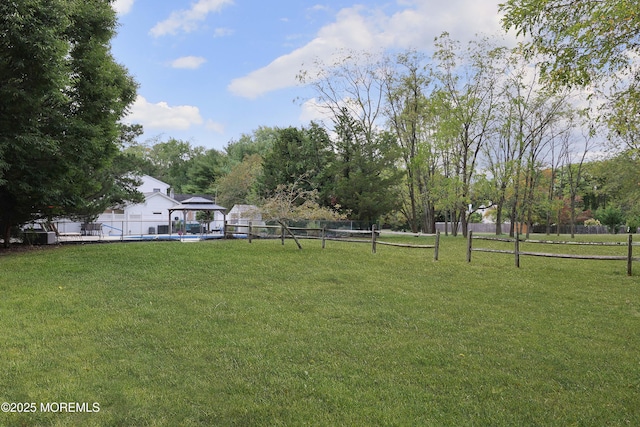 view of yard featuring a gazebo and fence