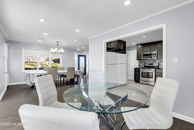 dining room featuring recessed lighting, baseboards, a chandelier, and ornamental molding