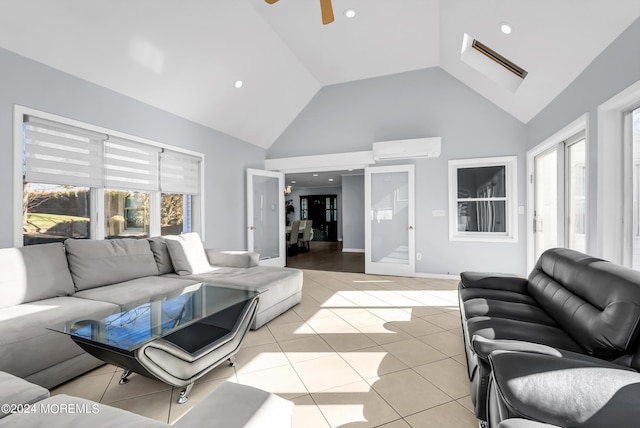 living room featuring light tile patterned floors, a ceiling fan, high vaulted ceiling, recessed lighting, and a wall mounted air conditioner