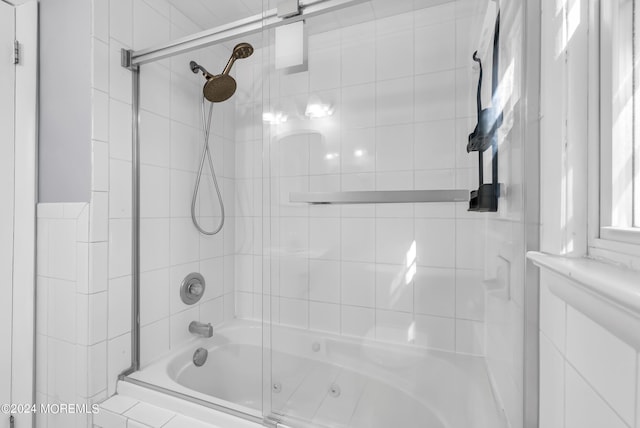 full bath featuring tiled shower / bath