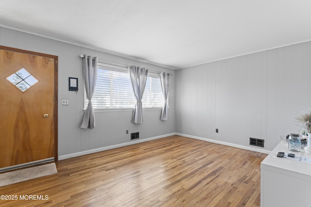 entryway with visible vents, baseboards, and light wood-style floors