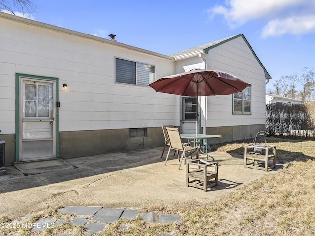 back of house featuring a patio area and fence