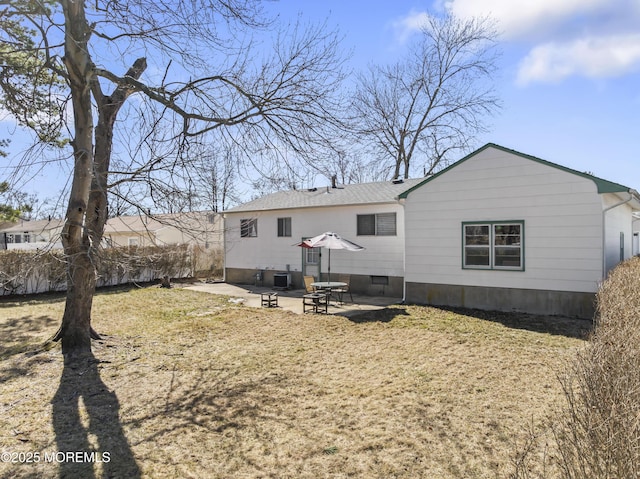 back of property with a patio and fence