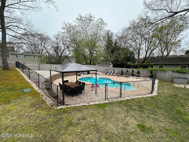 view of swimming pool featuring a patio, a fenced backyard, a gazebo, a yard, and a fenced in pool