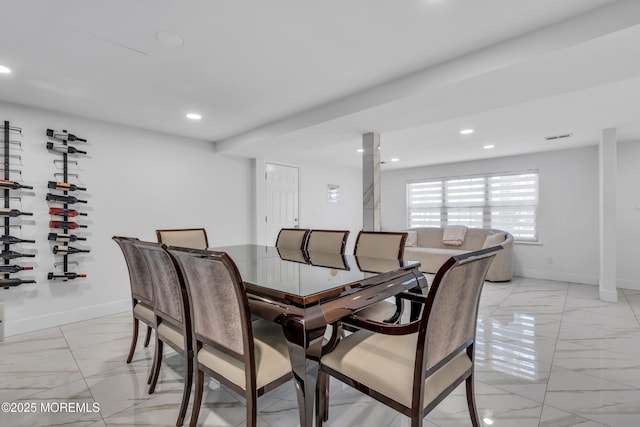 dining space featuring recessed lighting, marble finish floor, and baseboards