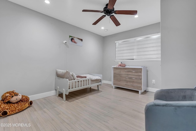 bedroom with recessed lighting, baseboards, and light wood-style floors