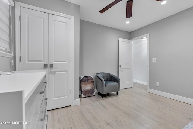 sitting room featuring recessed lighting, baseboards, light wood-style floors, and ceiling fan