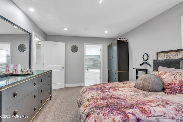 bedroom with recessed lighting, light colored carpet, ensuite bath, and baseboards