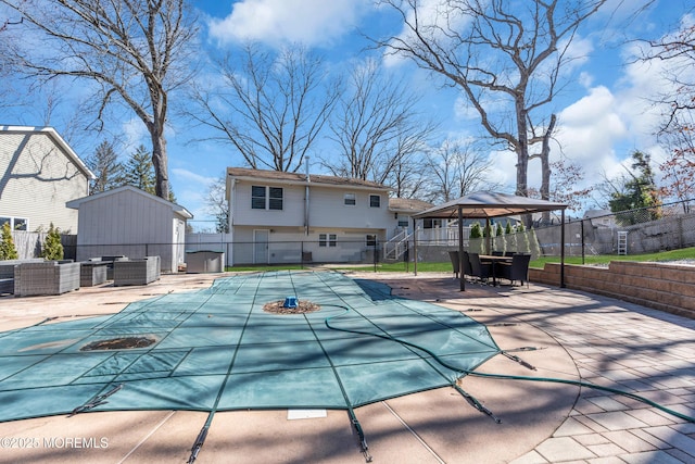 view of pool featuring a patio area, a fenced in pool, and fence