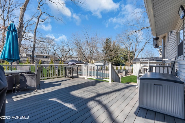 wooden deck featuring a residential view