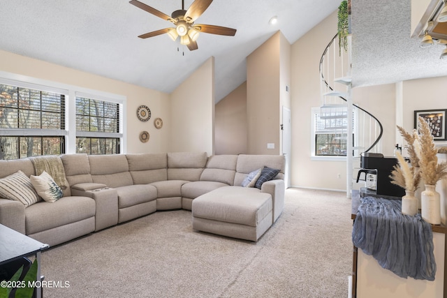 carpeted living room featuring a textured ceiling, lofted ceiling, baseboards, and ceiling fan