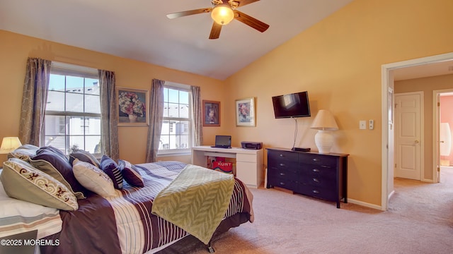 bedroom featuring vaulted ceiling, a ceiling fan, baseboards, and light carpet