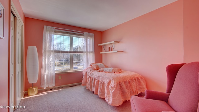 carpeted bedroom with baseboards